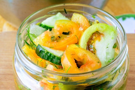 laying vegetables in cans